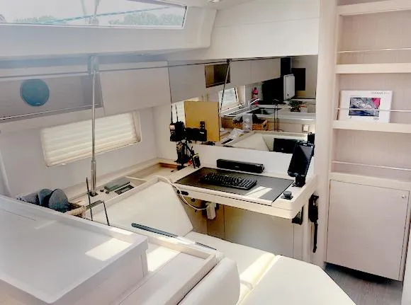 Slide: The Image of Modern interior of 2022 Beneteau Oceanis 51.1 yacht with sleek design and workspace. - 19