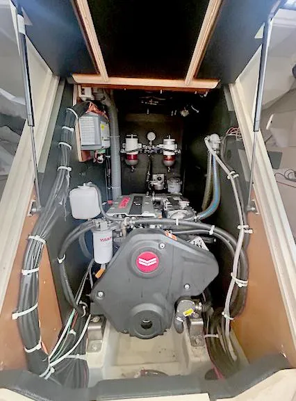 Slide: The Image of Engine compartment of 2022 Beneteau Oceanis 51.1 sailboat, featuring Yanmar engine and wiring. - 23