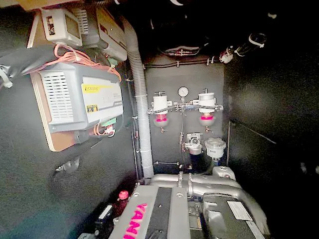 Slide: The Image of Engine room of 2022 Beneteau Oceanis 51.1 yacht, featuring Yanmar engine and electrical components. - 24