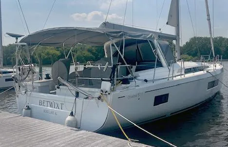 Slide: The Image of 2022 Beneteau Oceanis 51.1 yacht docked at marina, rear view. - 4
