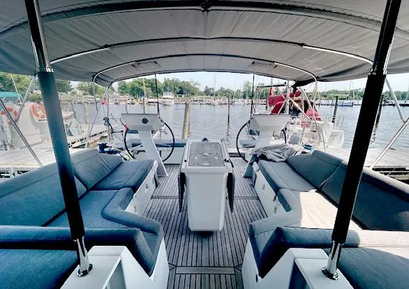 Slide: The Image of Spacious cockpit of 2022 Beneteau Oceanis 51.1 yacht with comfortable seating and dual steering wheels. - 6