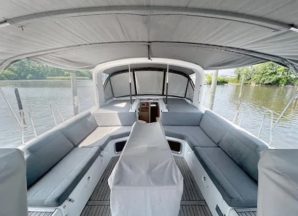 Slide: The Image of Spacious cockpit of 2022 Beneteau Oceanis 51.1 yacht with comfortable seating and canopy. - 7
