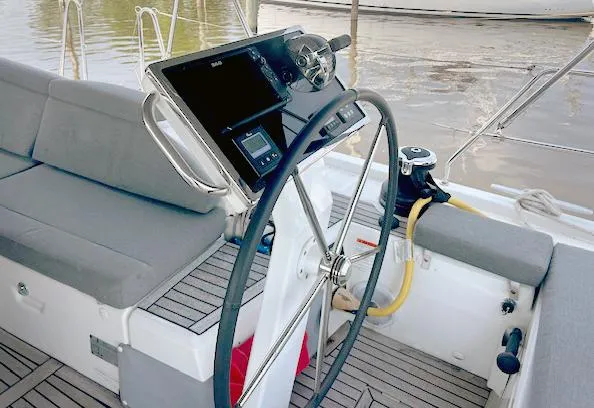Slide: The Image of Cockpit of 2022 Beneteau Oceanis 51.1 sailboat with steering wheel and navigation equipment. - 8