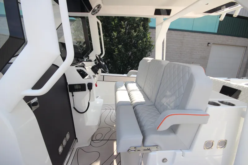 Slide: The Image of Interior view of 2026 Zodiac X10CC boat with advanced navigation system and speakers. - 17