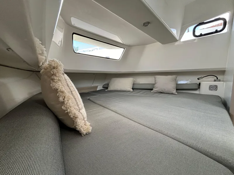 Slide: The Image of Luxurious cabin interior of 2025 Zodiac X10CC boat with plush cushions. - 12
