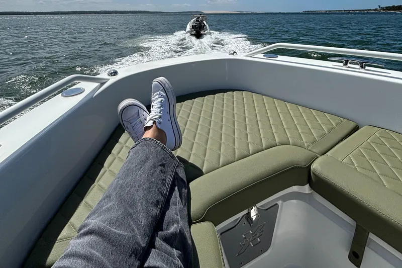 Slide: The Image of Person relaxing on Zodiac X10CC boat, 2025 model, cruising on open water. - 15