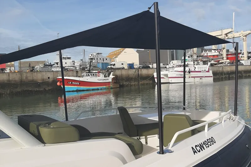 Slide: The Image of Zodiac X10CC boat with canopy docked in marina, 2025 model. - 16
