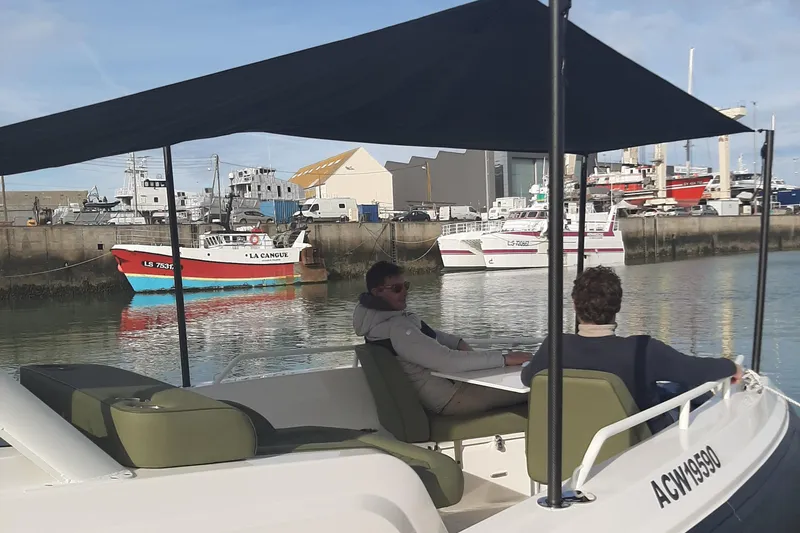 Slide: The Image of Zodiac X10CC boat with twin Yamaha 450 engines docked in a marina, 2025 model. - 17