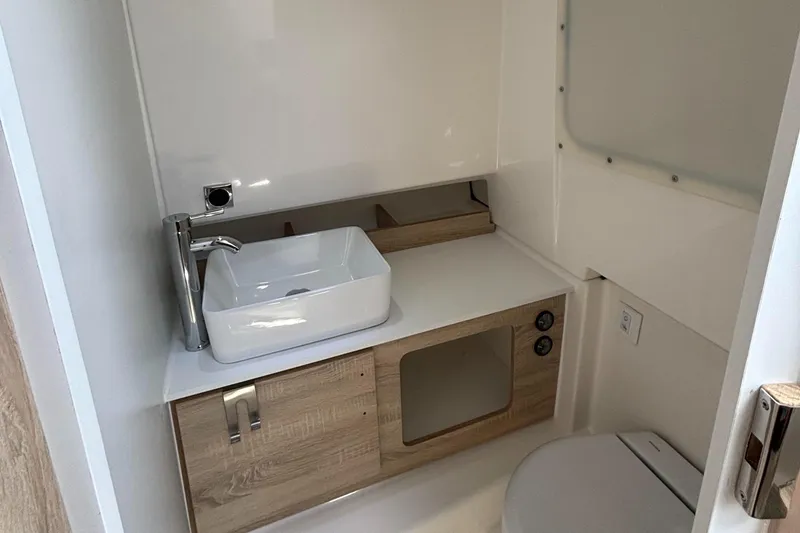 Slide: The Image of Modern bathroom in 2025 Zodiac X10CC boat with sleek sink and compact toilet. - 21