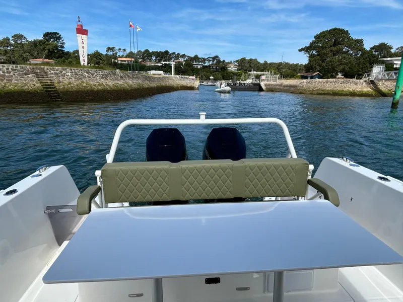 Slide: The Image of 2025 Zodiac X10CC boat with twin Yamaha 450 engines, featuring joystick control, docked in scenic harbor. - 8