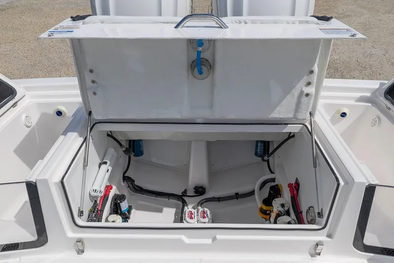 Slide: The Image of 2025 Sea Fox 282 Hybrid LT boat storage compartment with open lid, showcasing internal components. - 10