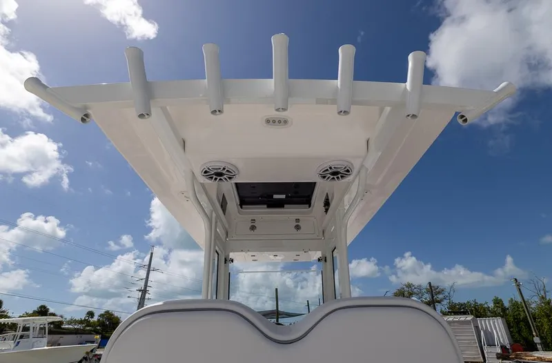 Slide: The Image of 2025 Sea Fox 282 Hybrid LT boat with T-top under clear blue sky. - 15