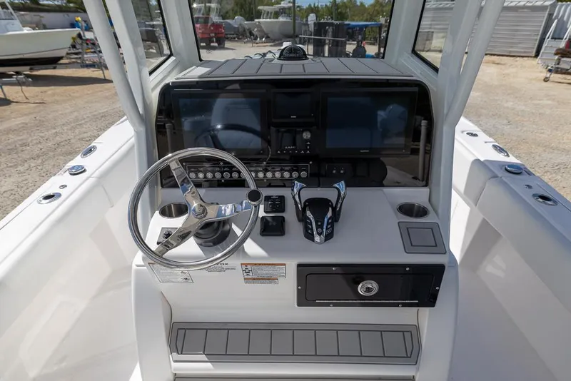 Slide: The Image of 2025 Sea Fox 282 Hybrid LT boat dashboard with steering wheel and control panel. - 16