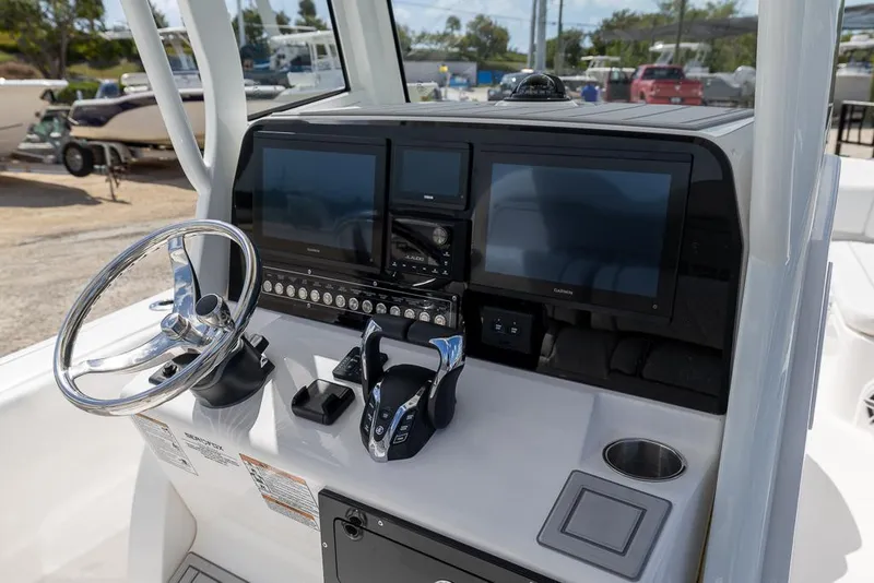 Slide: The Image of 2025 Sea Fox 282 Hybrid LT boat dashboard with modern controls and dual screens. - 17