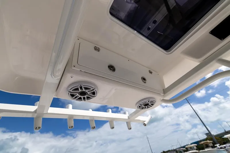 Slide: The Image of 2025 Sea Fox 282 Hybrid LT boat interior with speakers and rod holders. - 20