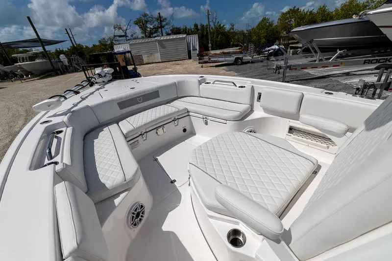 Slide: The Image of 2025 Sea Fox 282 Hybrid LT boat interior with white cushioned seating. - 21