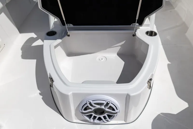Slide: The Image of 2025 Sea Fox 282 Hybrid LT boat storage compartment with speaker and cup holders. - 28