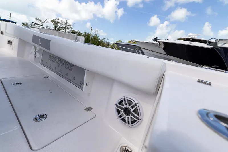 Slide: The Image of 2025 Sea Fox 282 Hybrid LT boat deck with speaker and storage compartment. - 29