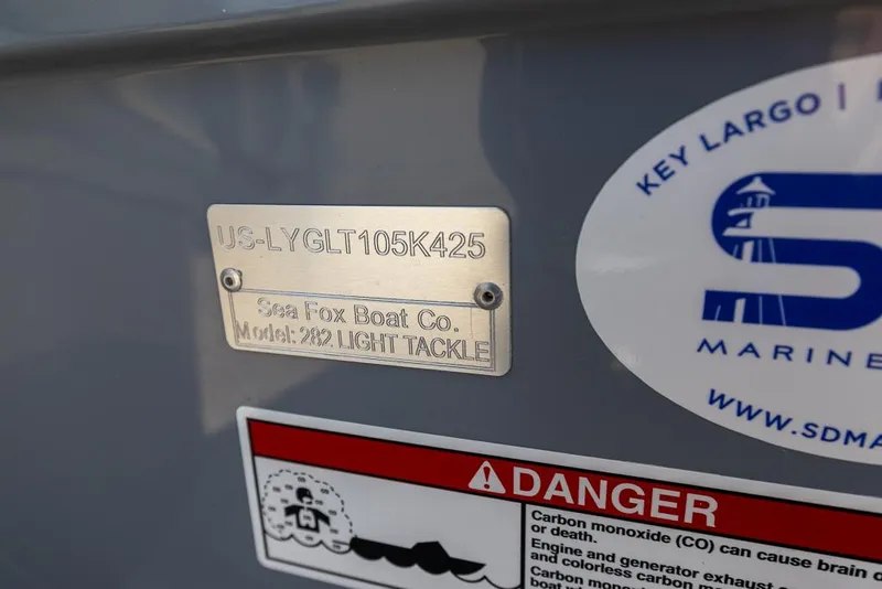 Slide: The Image of 2025 Sea Fox 282 Hybrid LT boat identification plate with safety warning label. - 34
