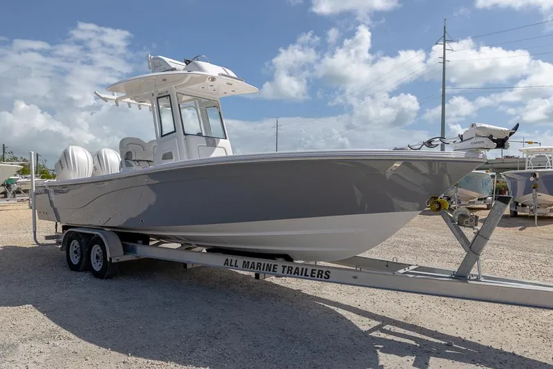 Slide: The Image of 2025 Sea Fox 282 Hybrid LT boat on trailer under a cloudy sky. - 6