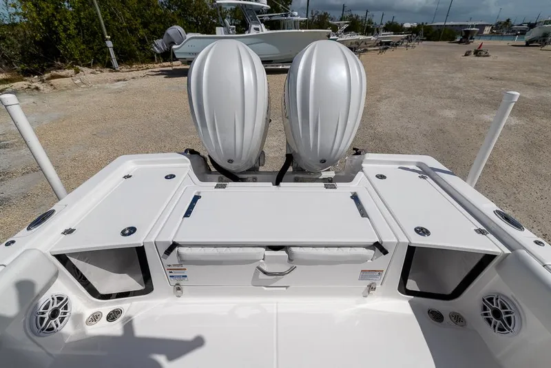 Slide: The Image of 2025 Sea Fox 282 Hybrid LT boat with dual outboard motors, rear deck view. - 7