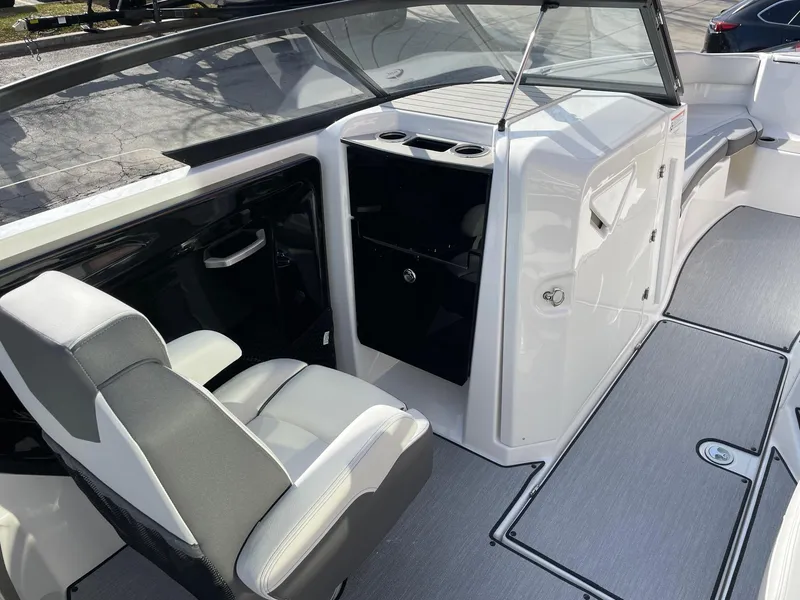 Slide: The Image of 2025 Yamaha Boats AR250 interior with sleek seating and modern dashboard design. - 10