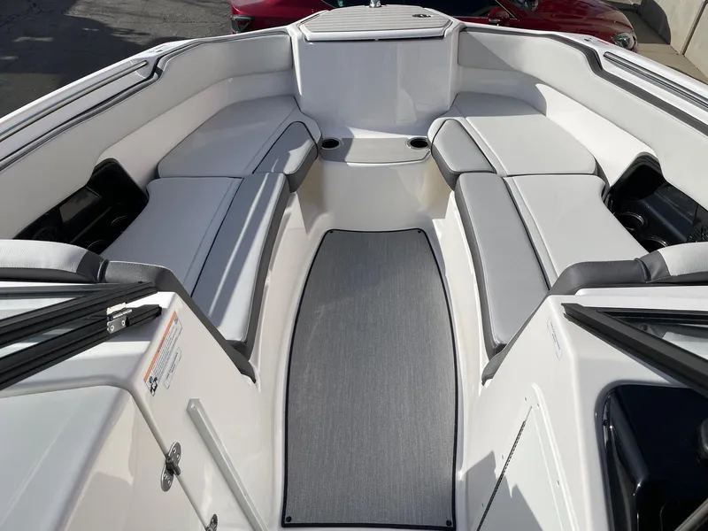 Slide: The Image of 2025 Yamaha Boats AR250 interior with spacious seating and sleek design. - 11