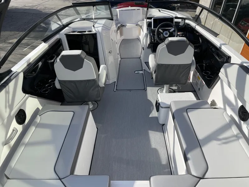 Slide: The Image of 2025 Yamaha Boats AR250 interior with modern seating and sleek design. - 5