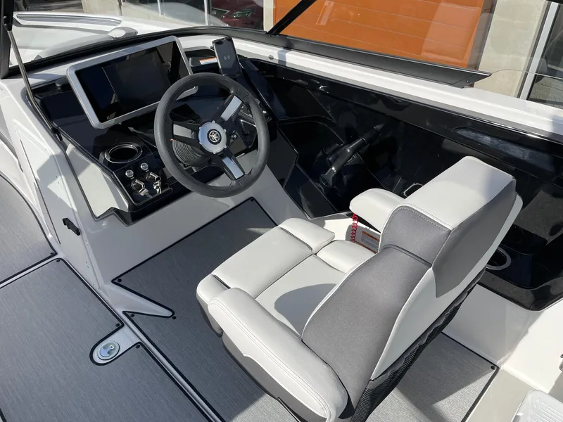 Slide: The Image of 2025 Yamaha AR250 boat cockpit with modern steering and controls. - 6