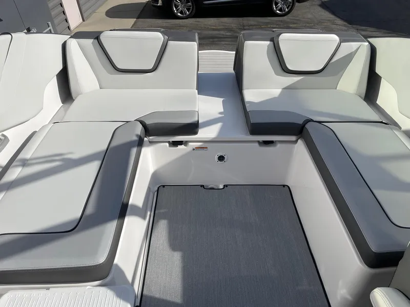 Slide: The Image of 2025 Yamaha Boats AR250 interior seating with modern design and gray upholstery. - 8