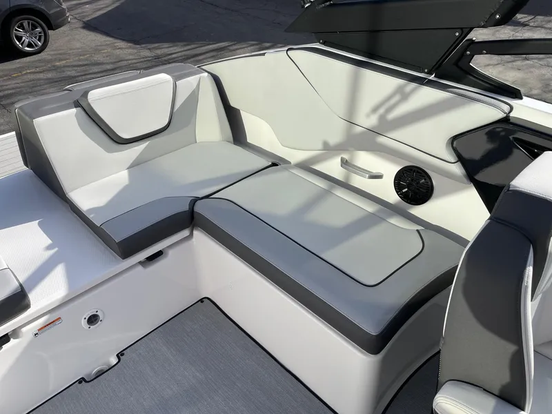 Slide: The Image of 2025 Yamaha AR250 boat interior with sleek gray seating and modern design. - 9