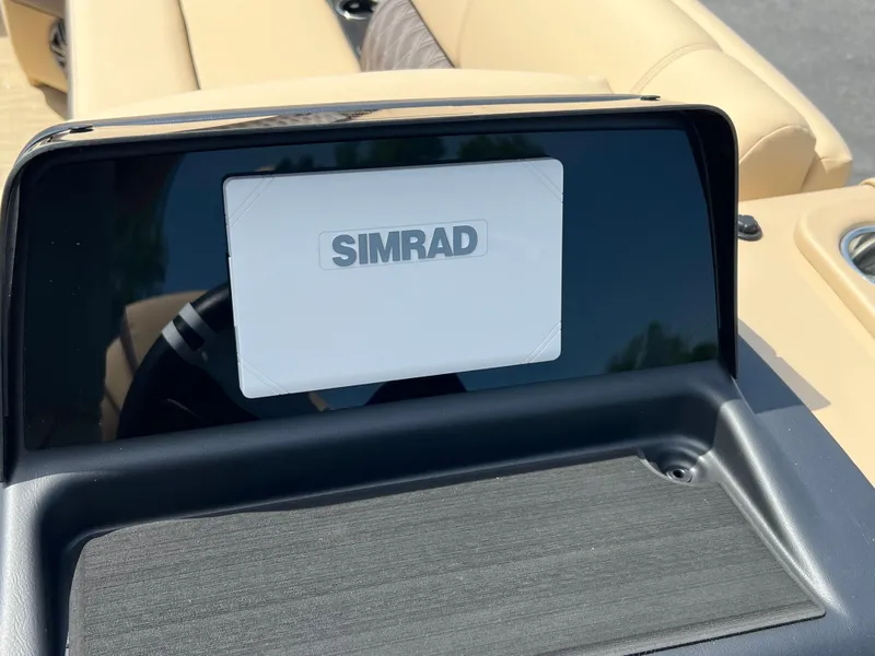 Slide: The Image of Simrad display on 2024 Harris Sunliner 230 boat dashboard. - 10