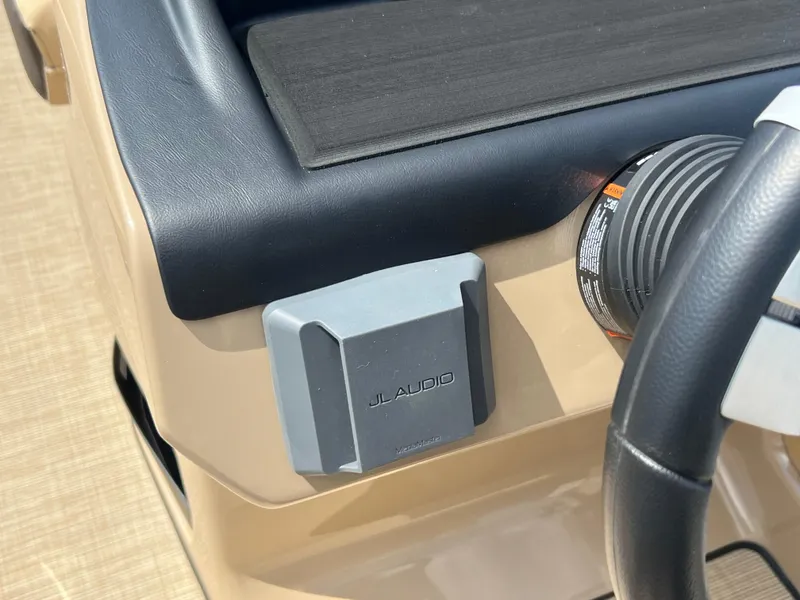 Slide: The Image of 2024 Harris Sunliner 230 dashboard with JL Audio speaker detail. - 11