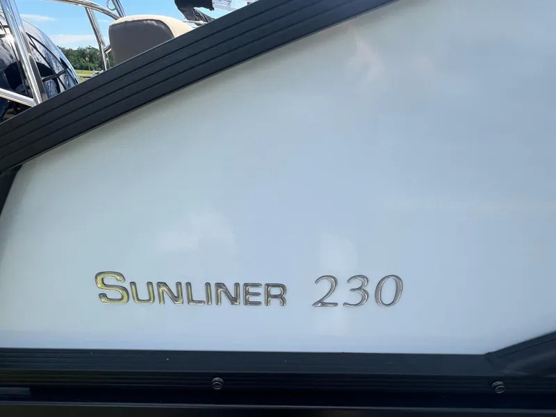 Slide: The Image of 2024 Harris Sunliner 230 boat nameplate in close-up view. - 4