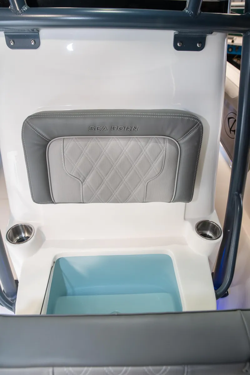Slide: The Image of 2025 Sea Born LX24 Center Console boat interior with cushioned seating and cup holders. - 17