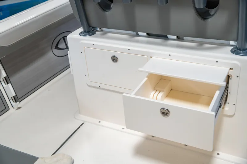Slide: The Image of 2025 Sea Born LX24 Center Console storage compartments with open drawer. - 20