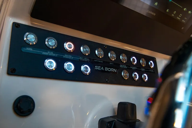 Slide: The Image of 2025 Sea Born LX24 Center Console dashboard with illuminated controls. - 23