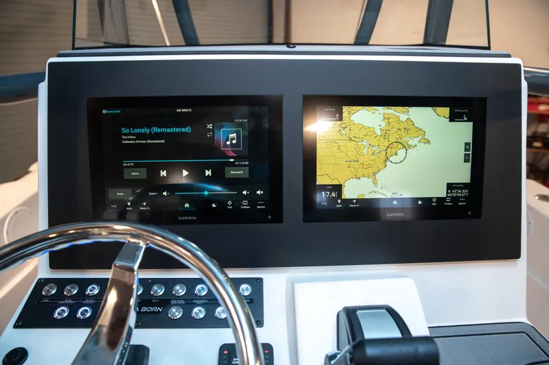 Slide: The Image of 2025 Sea Born LX24 Center Console dashboard with navigation and audio displays. - 24