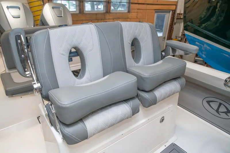 Slide: The Image of 2025 Sea Born LX24 Center Console boat seats, featuring modern gray and white upholstery. - 29