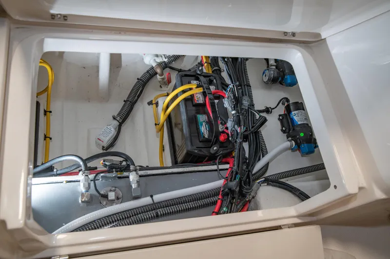 Slide: The Image of 2025 Sea Born LX24 Center Console boat wiring and battery compartment. - 30
