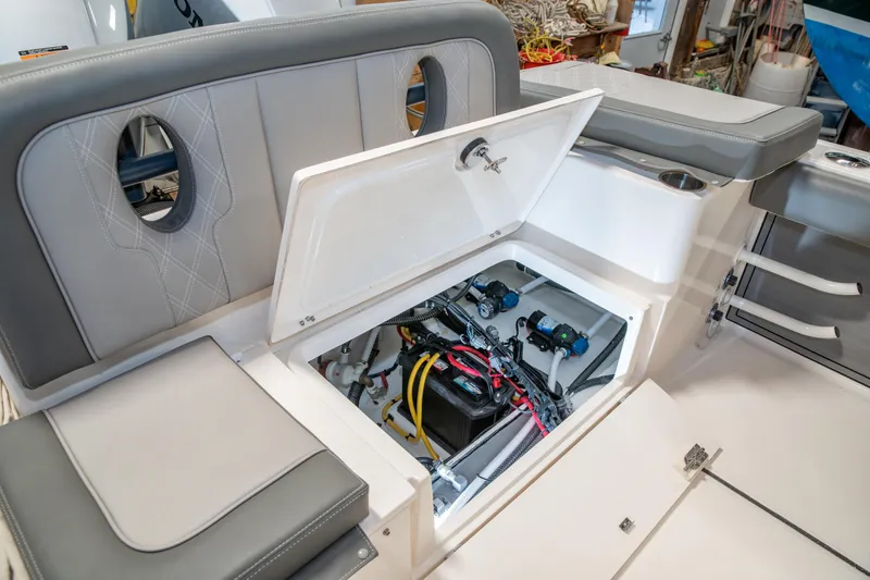 Slide: The Image of 2025 Sea Born LX24 Center Console boat interior with open storage compartment. - 31