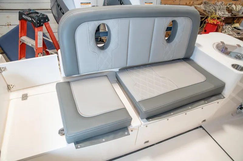 Slide: The Image of 2025 Sea Born LX24 Center Console boat with gray cushioned seating. - 32