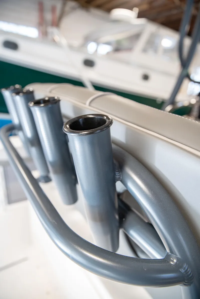 Slide: The Image of 2025 Sea Born LX24 Center Console boat rod holders in close-up view. - 33