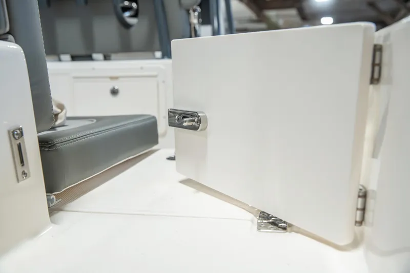 Slide: The Image of 2025 Sea Born LX24 Center Console boat interior with open storage compartment. - 35