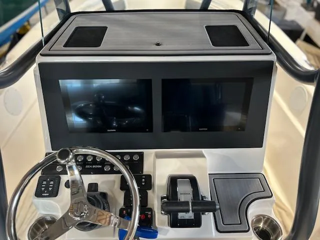 Slide: The Image of 2025 Sea Born LX24 Center Console dashboard with dual screens and steering wheel. - 6
