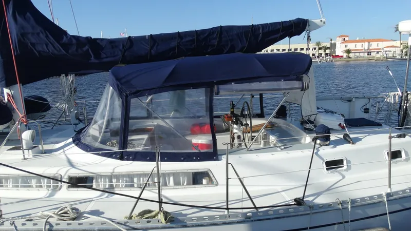 Slide: The Image of 1985 Gulfstar 45 Hirsch Center Cockpit sailboat docked in a marina. - 1