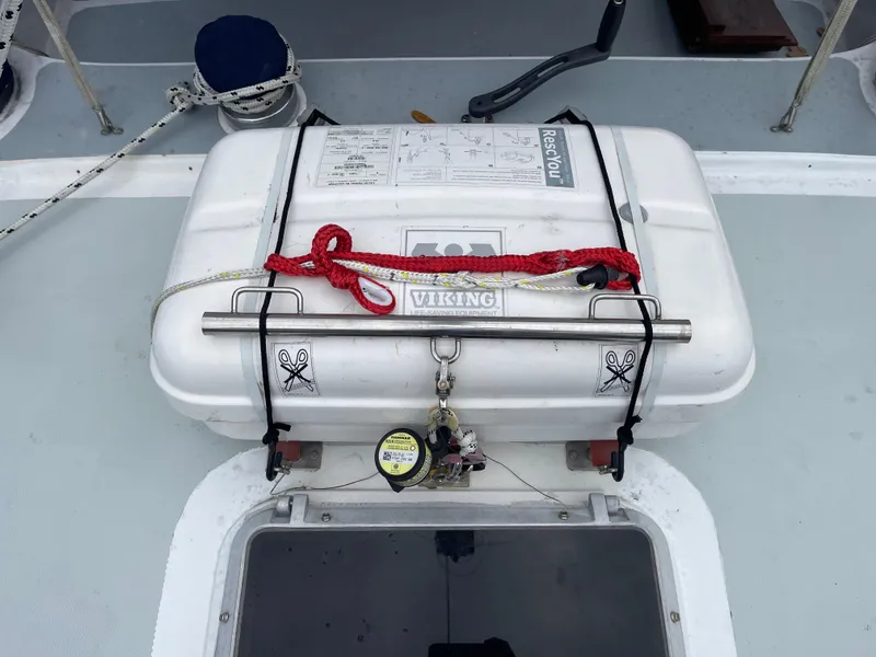 Slide: The Image of 1985 Gulfstar 45 Hirsch Center Cockpit with Viking life raft on deck. - 15