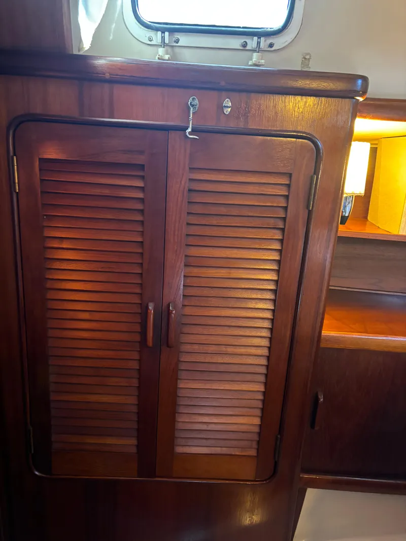 Slide: The Image of Wooden cabinet inside 1985 Gulfstar 45 Hirsch Center Cockpit yacht. - 24