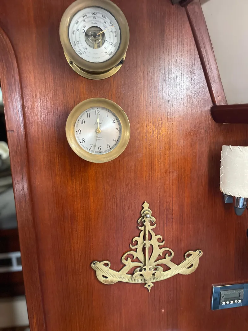 Slide: The Image of Wooden interior of 1985 Gulfstar 45 Hirsch Center Cockpit with brass instruments and decorative elements. - 31