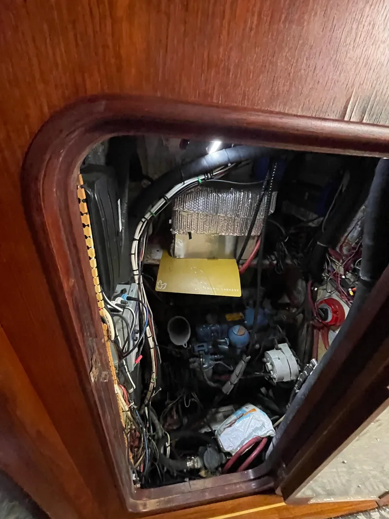 Slide: The Image of Engine compartment of 1985 Gulfstar 45 Hirsch Center Cockpit sailboat, showing wiring and components. - 41